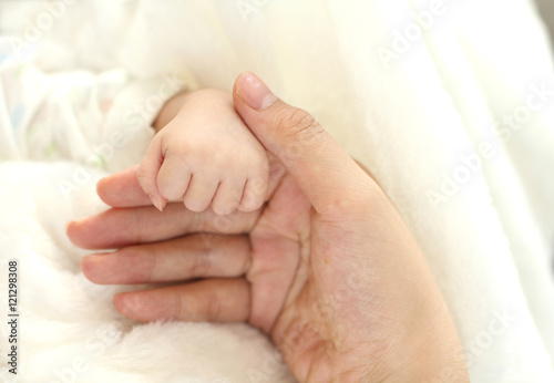 mother hand hold baby hand