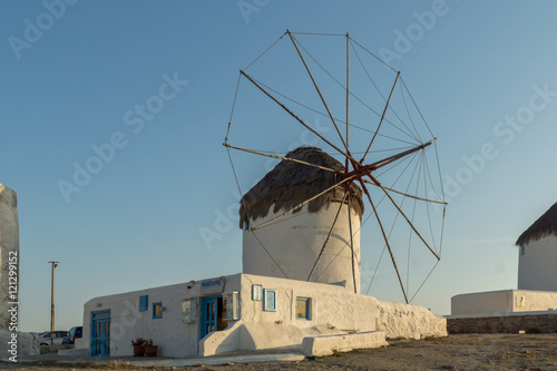 Sunset view of White windmills on the island of Mykonos, Cyclades, Greece