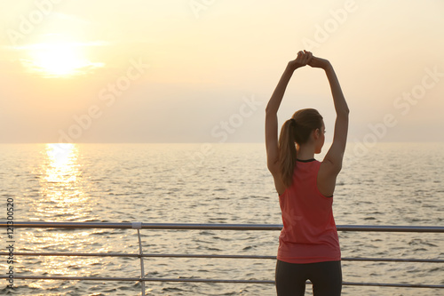Young woman doing exercises...