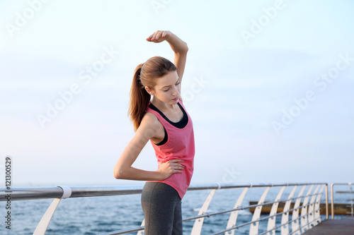 Young woman doing exercises...