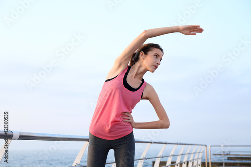Young woman doing exercises...