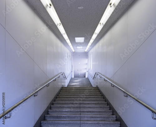 Passage way with stairs going underground in a subway