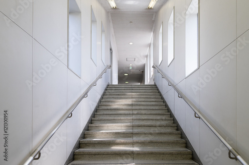 Passage way with stairs going underground in a subway