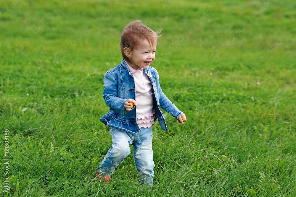 Baby girl walking on the grass (1 year old) Baby girl walking on the grass (1 year old)