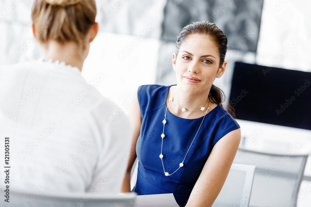 Two female colleagues in office Two female colleagues in office