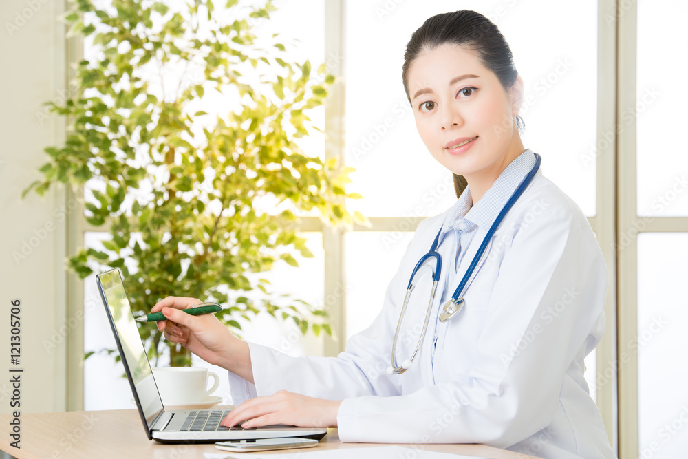 Doctor using computer to explain patient's condition, healthcare Doctor using computer to explain patient's condition, healthcare