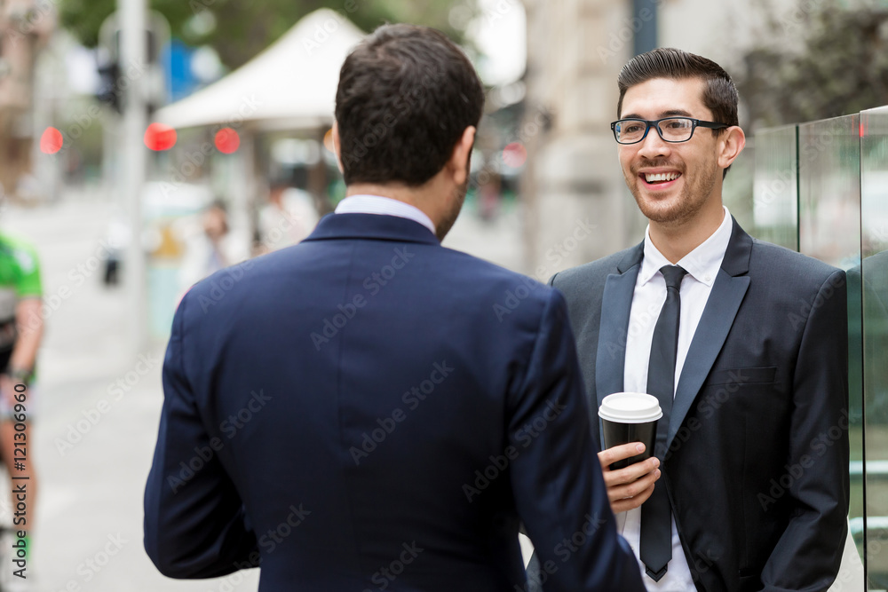 Two businessmen talking outdoors Two businessmen talking outdoors