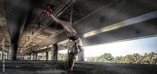 Female pole dancer performing outdoors