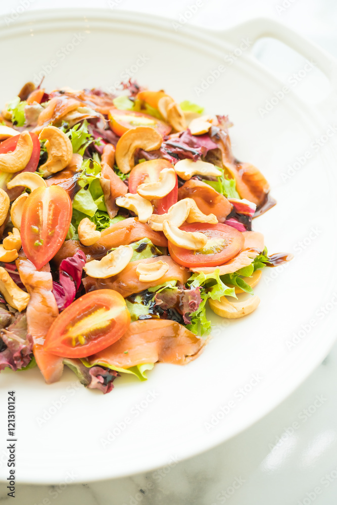 Tomato and vegetable salad with smoked salmon meat
