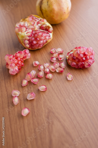Ripe pomegranate fruit on wooden background