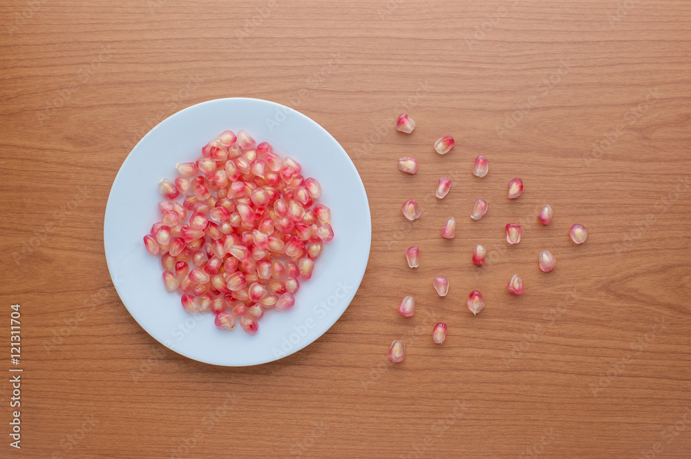 Ripe pomegranate fruit on wooden background Ripe pomegranate fruit on wooden background