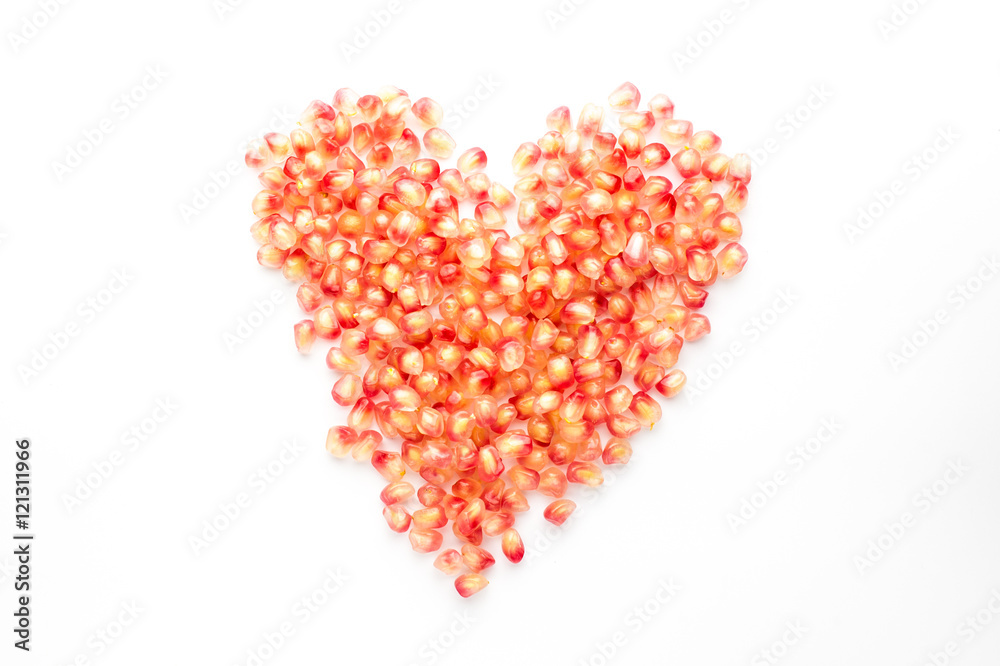 pomegranate and seeds on white background pomegranate and seeds on white background
