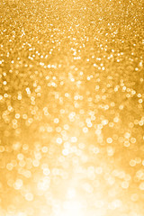 Glitzy gold glitter bokeh bling background or invite