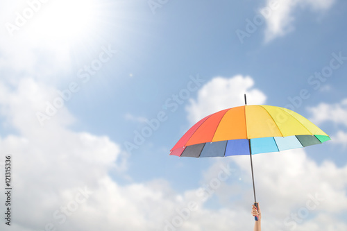 Holding colorful umbrella