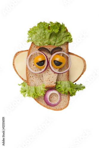Sad man made of bread and vegetables on isolated background