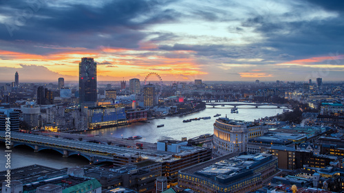 Skyline view of central London with famous landmarks, River Thames and skyscrapers at sunset - London, UK