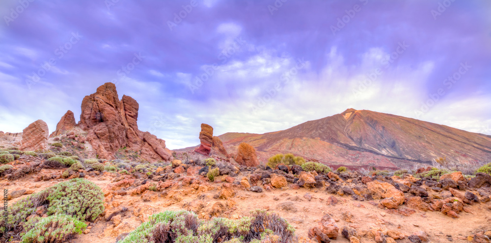 Roques de Garcia stone and Teide mountain volcano at the sunny morning in the Teide National Park, Tenerife, Canary Islands, Spain.