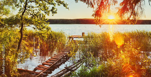 Sunset over the river. Panorama photo