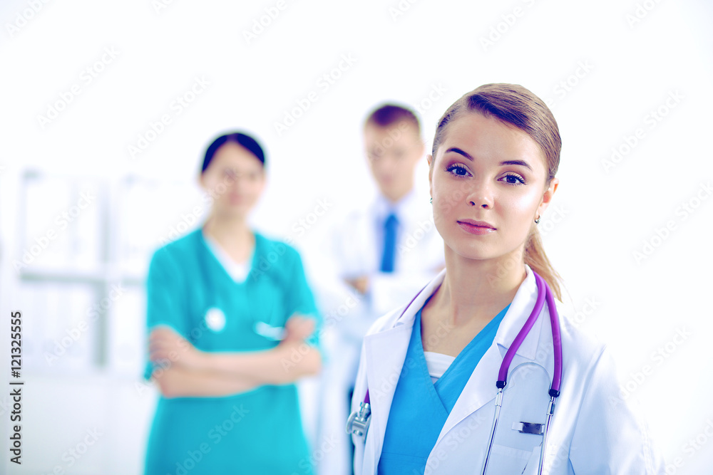 Woman doctor standing with stethoscope at hospital Woman doctor standing with stethoscope at hospital
