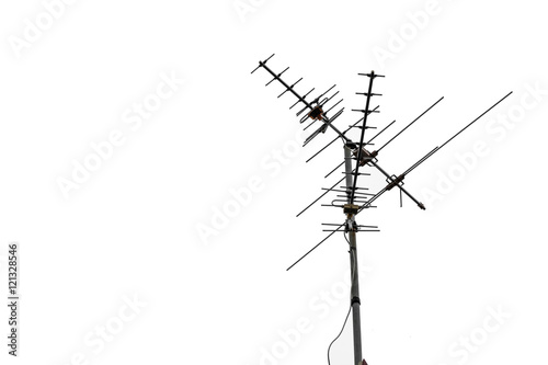TV and communication aerials on roof of residential house, isolated antennas and dish