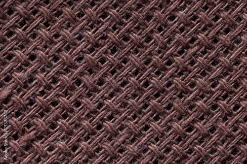 Brown textile background closeup. Structure of the fabric macro.