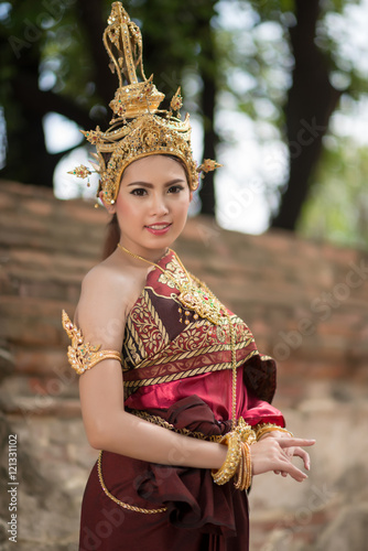 Beautiful asian woman portrait wearing typical thai dress with t