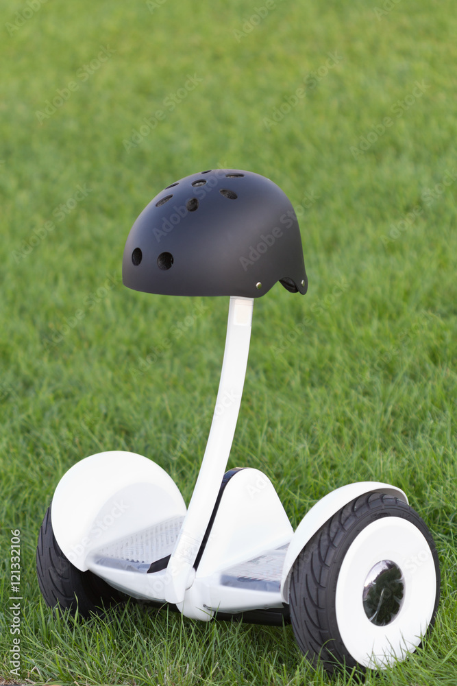 Obraz premium Black safety helmet on the segway