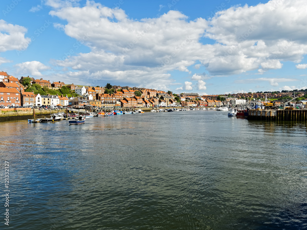 A bright calm day in Whitby Harbour, Yorkshire.