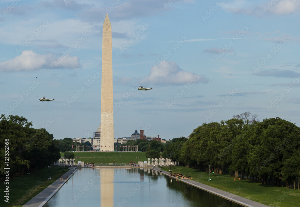 VH-3 Helicopters (Marine One) fly over the Washington monument