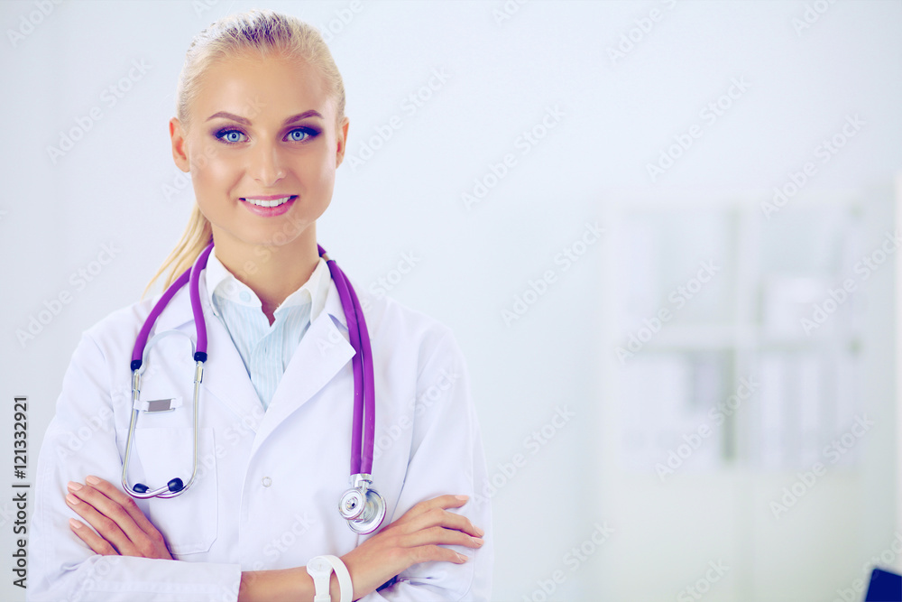 Portrait of young woman doctor with white coat standing in hosp Portrait of young woman doctor with white coat standing in hosp