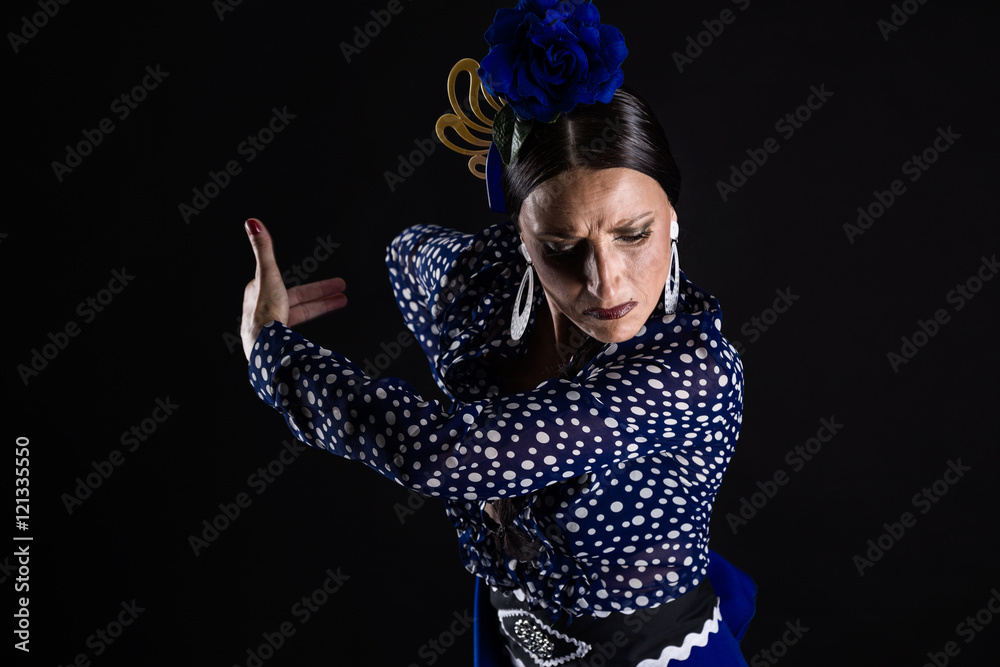 Young flamenco dancer in beautiful dress on black background. - obrazy, fototapety, plakaty 
