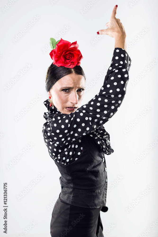 Pretty young flamenco dancer in beautiful dress.