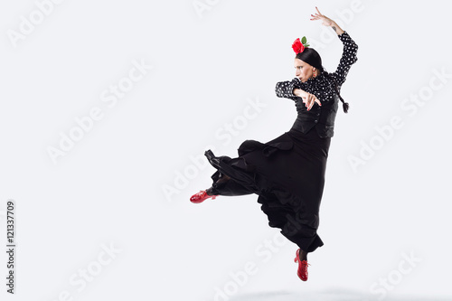 Pretty young flamenco dancer in beautiful dress.