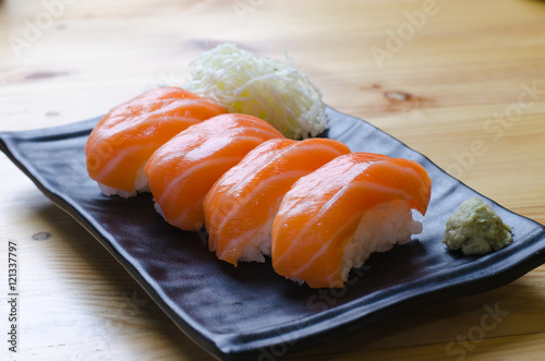 Fresh japanese salmon sushi on wood table