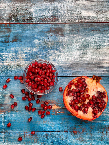 Pomegranate on vintege blue background photo