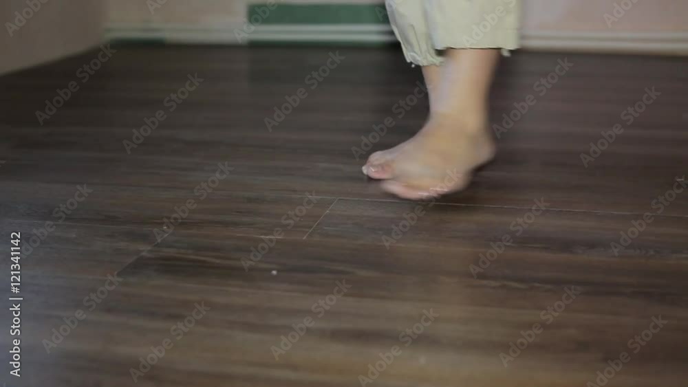 Worker puts the board flooring Worker puts the board flooring