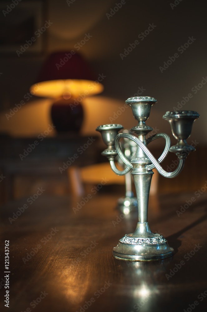 Silver candlestick on table