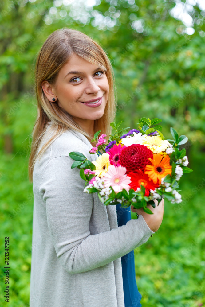 Happy girl with a bouquet of flowers Happy girl with a bouquet of flowers