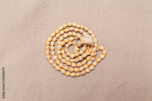 rolled chanting beads on woolen texture