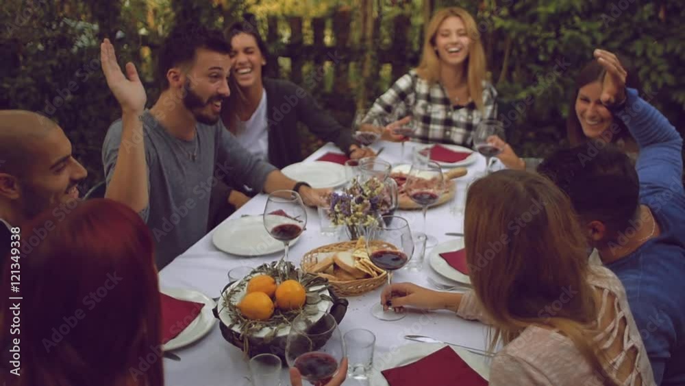 Group of friends enjoying together at a dinner party
Group of friends enjoying together at a dinner party