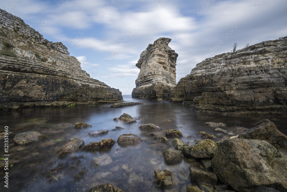huge rocks on the sea with long exposure shot