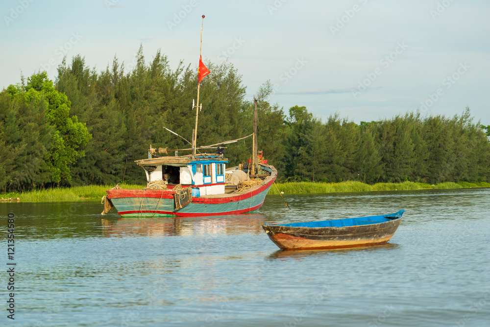 Floating boats on Thu Bon river near ancient Hoi An Floating boats on Thu Bon river near ancient Hoi An