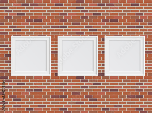 Set of white photo frames on brick wall