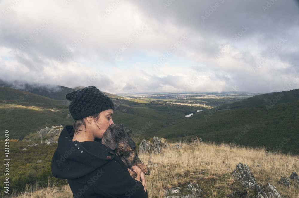 Woman hiking on a cloudy autumn day