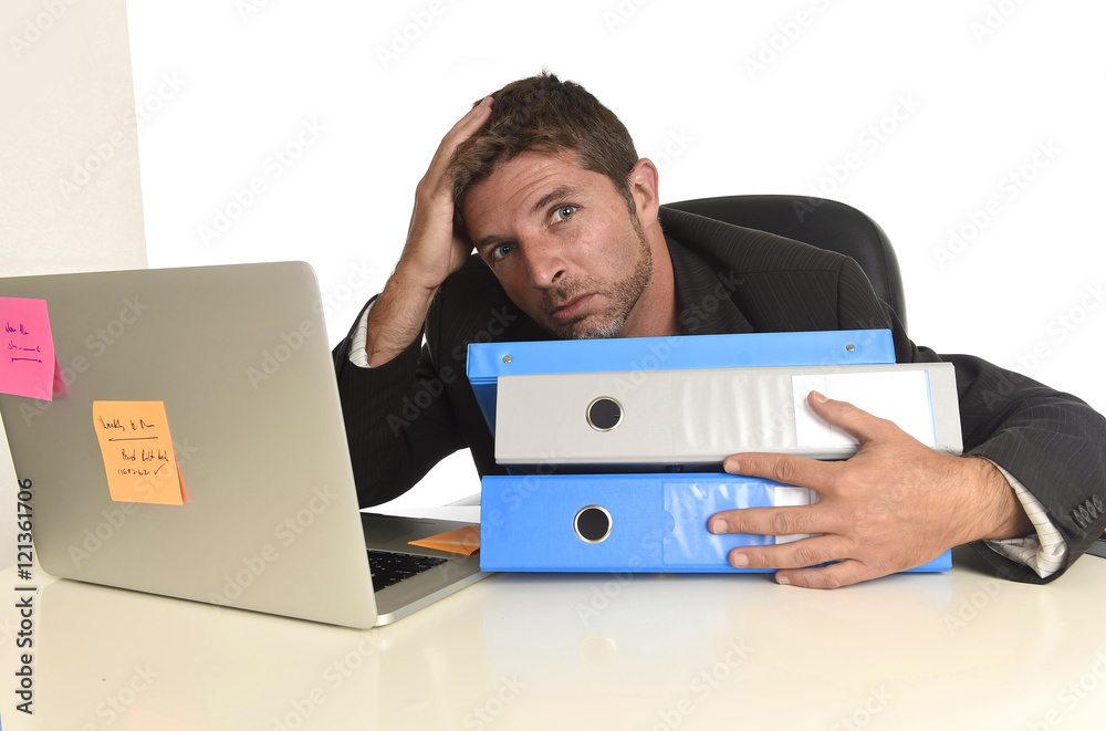 exhausted businessman suffering stress at office computer desk exhausted businessman suffering stress at office computer desk