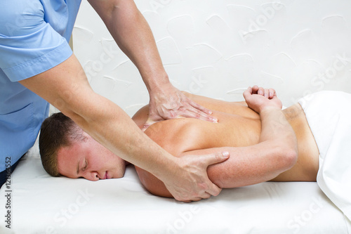 young man on wellness treatments sports massage