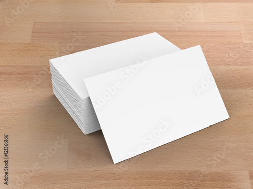 stack of blank name cards on wooden background