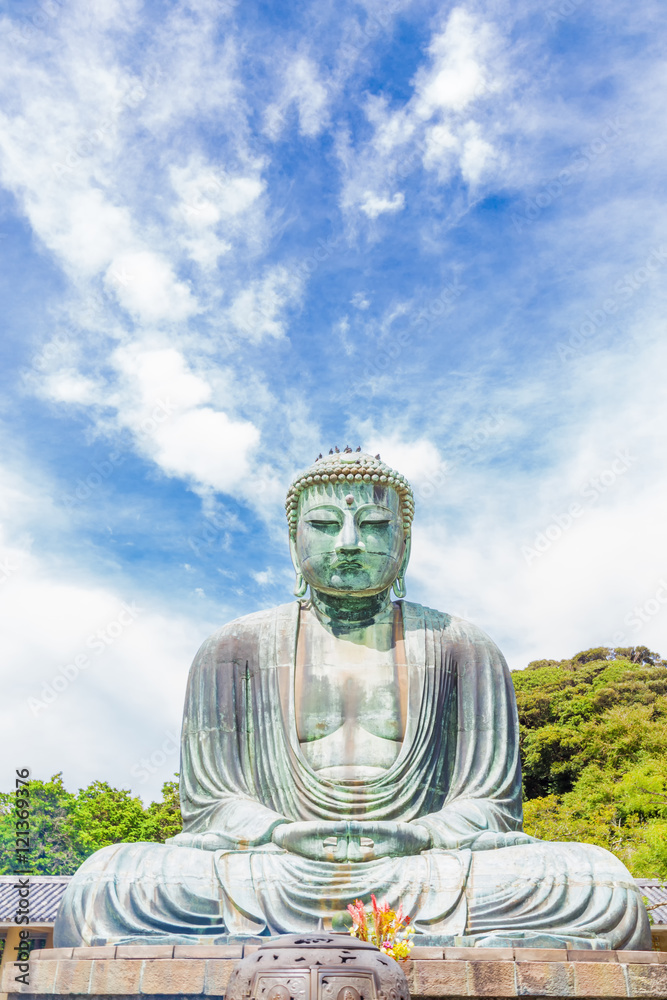 The Great Buddha in Kamakura. Located in Kamakura, Kanagawa Prefecture Japan.There are pigeon to Buddha's head. The Great Buddha in Kamakura. Located in Kamakura, Kanagawa Prefecture Japan.There are pigeon to Buddha's head.
