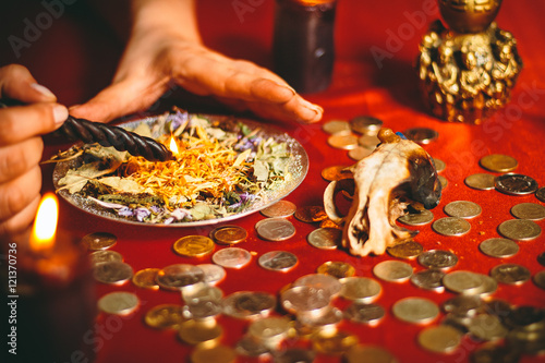 a witch holds a ritual for money