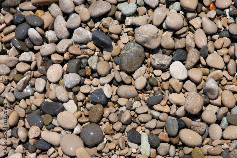 texture of beautiful wet round colored sea pebbles on pebble bea texture of beautiful wet round colored sea pebbles on pebble bea